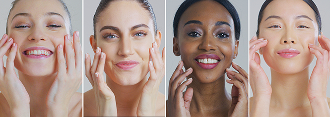 Four women caress their face after HydraFacial MD skin rejuvenation treatment.